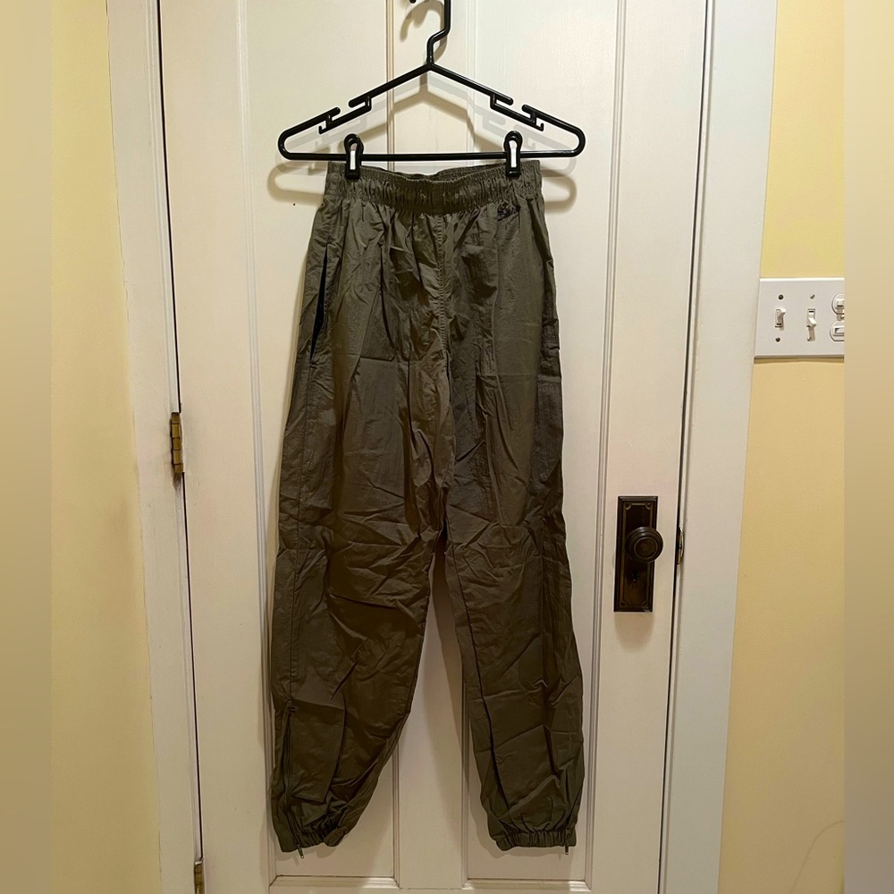 green Catalina parachute pants with zip bottoms, scrunch pant leg, and pockets